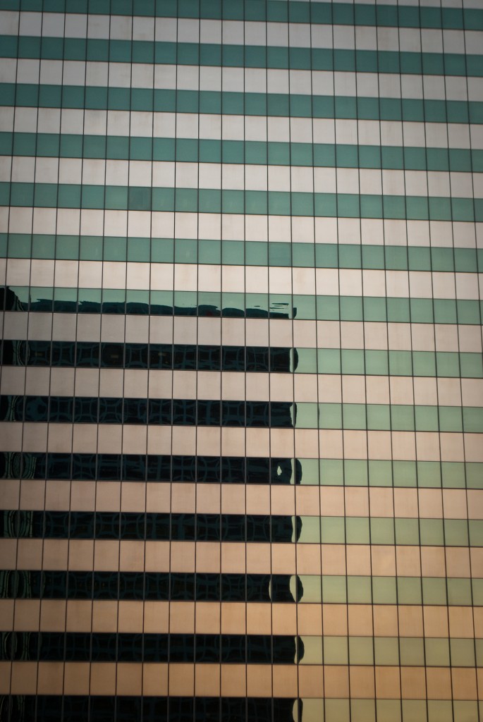 7-JUN-2013: The light of the sunset and the outline of another building reflected in the glass of the 444 Flower building in DTLA.