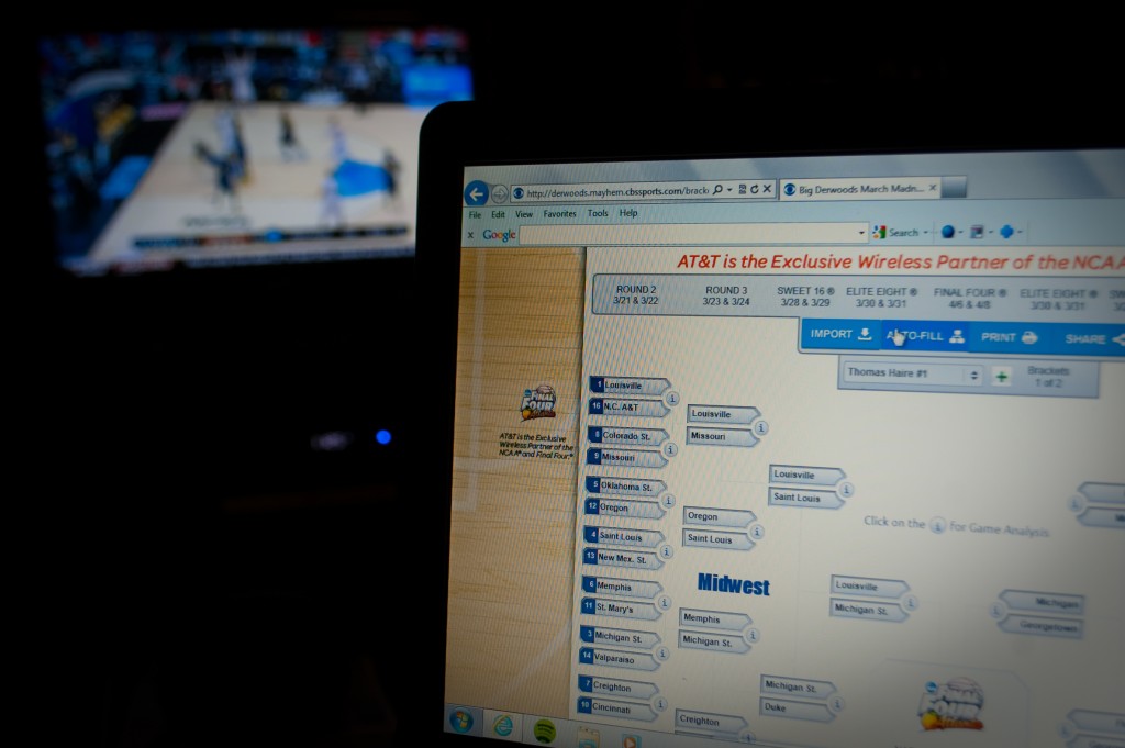 20-MAR-2013: Tourney Time! Research on the TV, while filling out the bracket on my laptop screen.