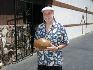 Chuck Stump holds his beloved 1932 Rose Bowl game ball in 2004.