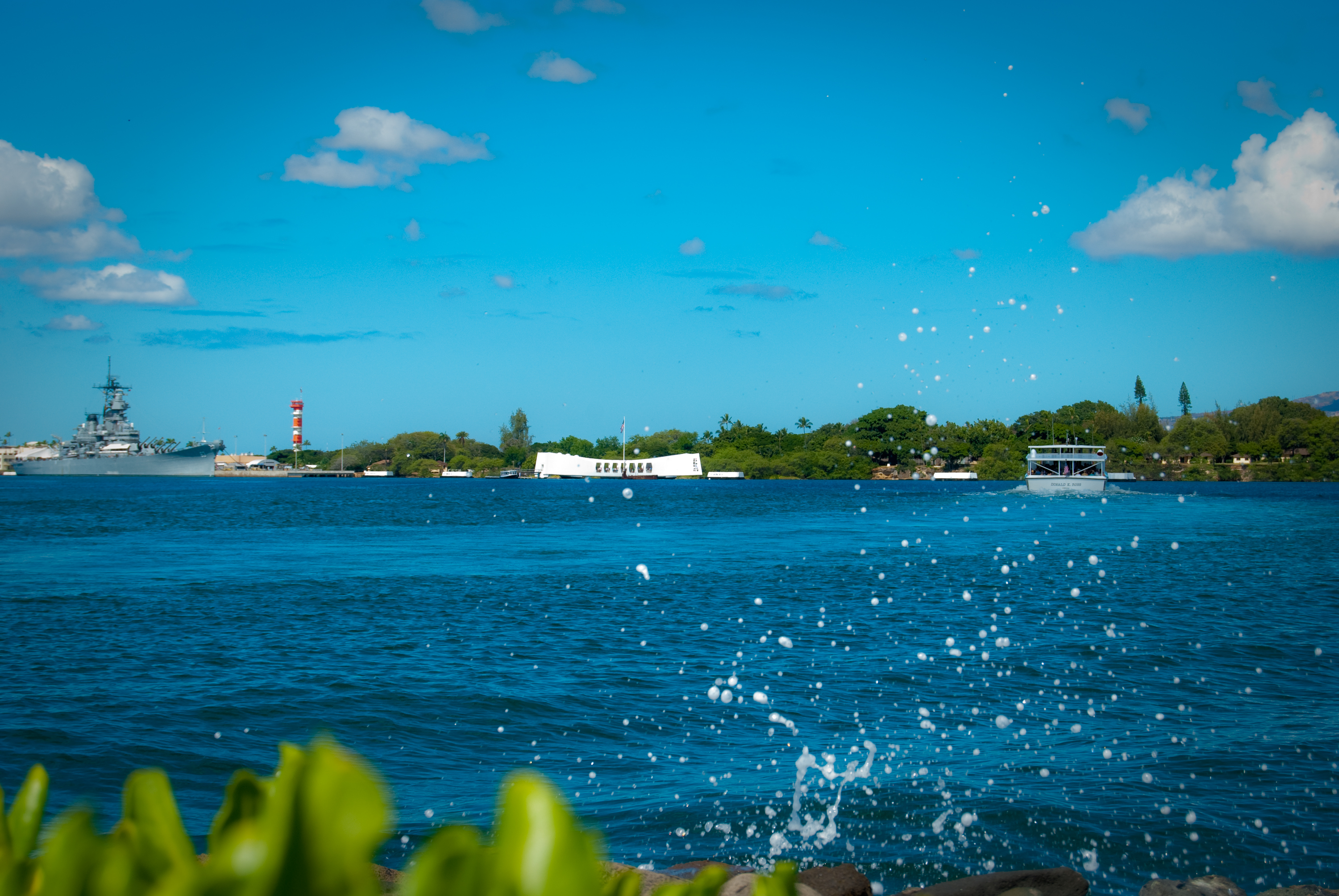 29-AUG-2013: Love this image of the USS Arizona Memorial in Pearl Harbor, with the surf spraying off the seawall in the foreground.