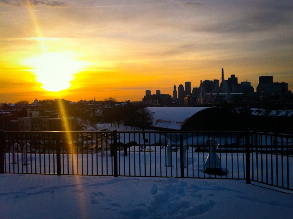 20-DEC-2013: After a red-eye to Boston, a snow-filled sunrise over the city from a Charlestown rooftop.