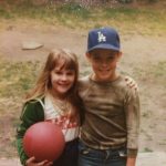 With my sister in the backyard in Fullerton. Homeplate for my Scully-inspired re-enactments is right behind us.